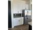 Stainless steel appliances and white shaker cabinets in kitchen at 4237 E 4Th Ave, Apache Junction, AZ 85119