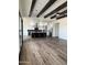 Open kitchen boasts an island, stainless steel appliances, and wood-look flooring at 4237 E 4Th Ave, Apache Junction, AZ 85119