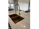 Sleek kitchen sink with a gold faucet and marble countertop at 4237 E 4Th Ave, Apache Junction, AZ 85119