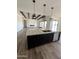 Open concept kitchen with a large island and marble countertops at 4237 E 4Th Ave, Apache Junction, AZ 85119