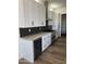 Modern kitchen with white cabinets and geometric backsplash at 4237 E 4Th Ave, Apache Junction, AZ 85119