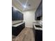 Laundry room with navy cabinets and granite countertops at 4237 E 4Th Ave, Apache Junction, AZ 85119
