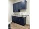 Laundry Room with navy cabinets and granite countertops at 4237 E 4Th Ave, Apache Junction, AZ 85119