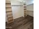 Spacious walk-in closet with built-in shelving and hanging rods at 4237 E 4Th Ave, Apache Junction, AZ 85119