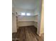 Large walk-in closet with ample shelving and hanging space at 4237 E 4Th Ave, Apache Junction, AZ 85119