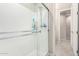 Modern shower with glass enclosure and built-in shelving at 44033 W Palo Olmo Rd, Maricopa, AZ 85138