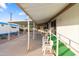 Mobile home with covered patio, chairs, and partial view of the backyard at 530 S Alma School Rd # 37, Mesa, AZ 85210