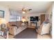 Spacious living room with large TV and comfy seating at 530 S Alma School Rd # 37, Mesa, AZ 85210
