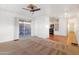 Living area with patio access, ceiling fan, and carpet at 535 S Alma School Rd # 12, Mesa, AZ 85210