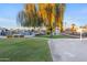Community pool and grassy area with trees at 535 S Alma School Rd # 12, Mesa, AZ 85210