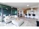 Open concept living space with modern kitchen, sofa and access to balcony at 7120 E Kierland Blvd # 416, Scottsdale, AZ 85254