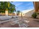 White patio furniture with a table on a paved patio at 931 Leisure World -- # 931, Mesa, AZ 85206