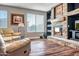 Stone fireplace with built-in shelving in living room at 10439 W Cashman Dr, Peoria, AZ 85383