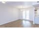 Bright dining room with hardwood floors and french doors leading to patio at 10514 W Bright Angel Cir, Sun City, AZ 85351