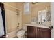 Bathroom with a shower/tub combo, vanity, and tile floor at 12844 W El Sueno Dr, Sun City West, AZ 85375