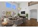 Open living room with high ceilings and hardwood floors at 1328 E Cottonwood Ln, Phoenix, AZ 85048