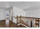 Upper hallway with wood floors and staircase at 1328 E Cottonwood Ln, Phoenix, AZ 85048