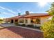 House exterior with red tile roof and desert landscaping at 14510 W White Rock Dr, Sun City West, AZ 85375