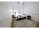 Cozy bedroom with a metal bed frame and light-colored walls at 2143 W Wilshire Dr, Phoenix, AZ 85009