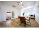 Bright dining area with a round wooden table and four brown leather chairs at 2143 W Wilshire Dr, Phoenix, AZ 85009