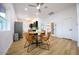 Open concept dining area with a view into the kitchen and living room at 2143 W Wilshire Dr, Phoenix, AZ 85009