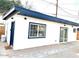 Modern exterior with blue accents and sliding glass doors at 2143 W Wilshire Dr, Phoenix, AZ 85009