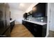 Modern kitchen with stainless steel appliances and ample cabinet space at 2143 W Wilshire Dr, Phoenix, AZ 85009