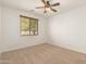 Bright bedroom with ceiling fan and window with blinds at 3671 N Monument Dr, Florence, AZ 85132