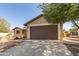 Front view of house with brown garage door at 3671 N Monument Dr, Florence, AZ 85132