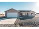 Modern single-story house with attached garage and desert landscaping at 3965 N Montgomery Cir, Eloy, AZ 85131