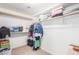 Large walk-in closet with shelving and rods at 9173 W Salter Dr, Peoria, AZ 85382