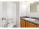 Clean bathroom with single sink vanity, toilet and shower/tub combination at 11640 N 51St Ave # 250, Glendale, AZ 85304