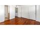 Bedroom with hardwood floors, closet and laundry area at 11640 N 51St Ave # 250, Glendale, AZ 85304