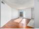 Living room with hardwood floors and sliding glass door at 11640 N 51St Ave # 250, Glendale, AZ 85304