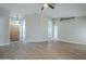 Bright living room featuring light gray walls and wood-look flooring at 131 W Ivanhoe St, Gilbert, AZ 85233