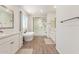 Spa-like bathroom with soaking tub, glass shower, and modern vanity at 17243 W Seldon Ln, Waddell, AZ 85355