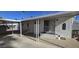 Covered entryway to manufactured home with metal railing and welcome sign at 25 S 102Nd St # 92, Mesa, AZ 85208