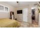 Bright bedroom with tiled floors and a built-in closet at 2746 W Turney Ave, Phoenix, AZ 85017