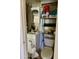 Small bathroom with toilet, sink, and storage shelving at 7750 E Broadway Rd # 149, Mesa, AZ 85208