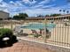 Inviting community pool with lounge chairs and fenced area at 7750 E Broadway Rd # 149, Mesa, AZ 85208