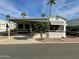 Single-wide manufactured home with carport and mature landscaping at 7750 E Broadway Rd # 149, Mesa, AZ 85208