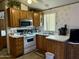 Galley kitchen with ample storage and stainless steel appliances at 7750 E Broadway Rd # 149, Mesa, AZ 85208