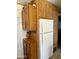 Kitchen boasts ample wood cabinetry and a refrigerator at 7750 E Broadway Rd # 149, Mesa, AZ 85208