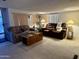 Living room with two sofas, end tables, and carpeted flooring at 7750 E Broadway Rd # 149, Mesa, AZ 85208