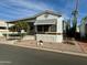 Mobile home exterior with covered porch and desert landscaping at 7750 E Broadway Rd # 149, Mesa, AZ 85208