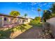 Backyard view of property, showcasing lawn and landscaping at 10303 W Deanne Dr, Sun City, AZ 85351