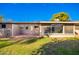 View of backyard with patio and surrounding landscape at 10303 W Deanne Dr, Sun City, AZ 85351