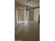 Dining area with chandelier and sliding glass doors at 12459 W Benito Dr, Arizona City, AZ 85123