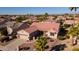 One-story home with tile roof and desert landscaping at 16316 W Willow Creek Ln, Surprise, AZ 85374