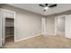 Bedroom with carpet flooring, ceiling fan, and closet at 18645 N 71St Dr, Glendale, AZ 85308